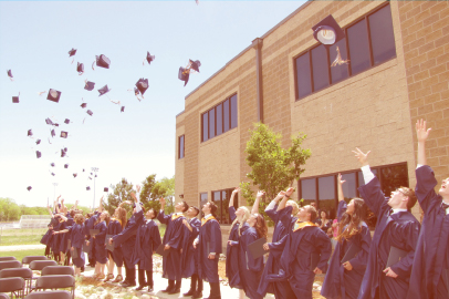Graduates of The Vanguard School celebrate by tossing their caps